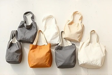 Various eco-bags organized neatly, showcasing different materials.