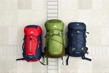 Collection of hiking backpacks in different sizes for comparison.