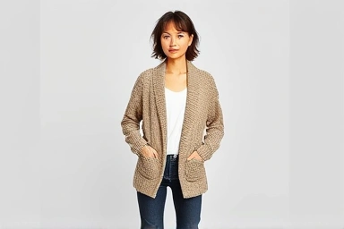 Model wearing a popcorn knit cardigan with jeans, demonstrating casual chic.