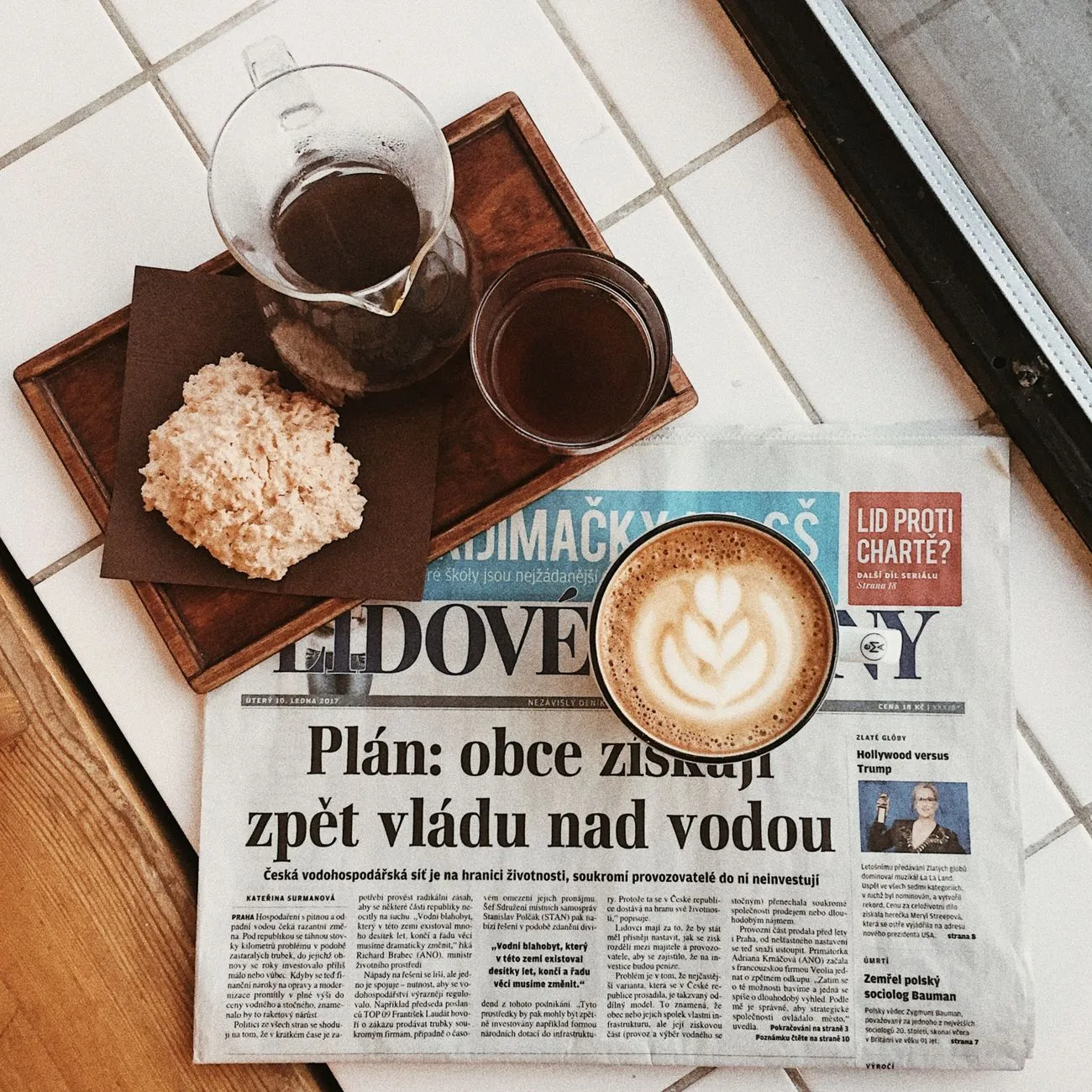 donut and a cup of espresso on a cafe table