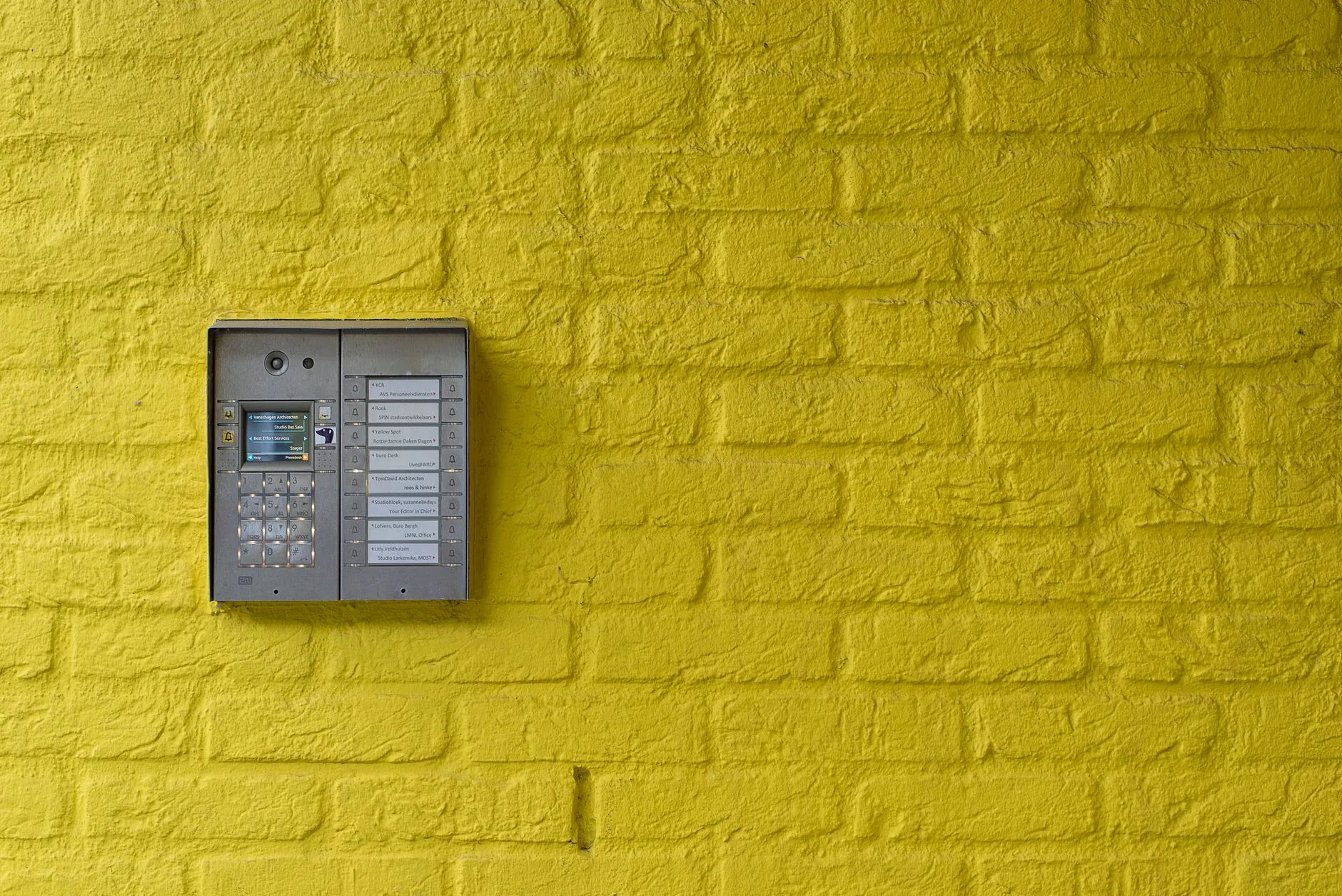 A modern secure-entry keypad on a bright wall