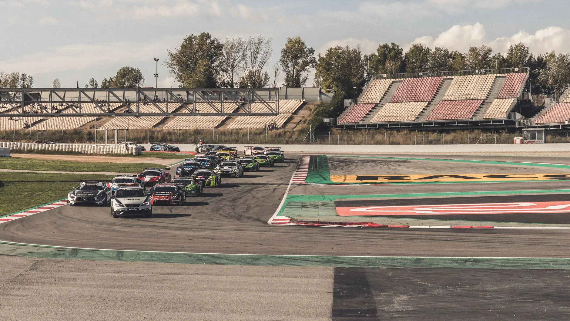 race cars battling through a corner