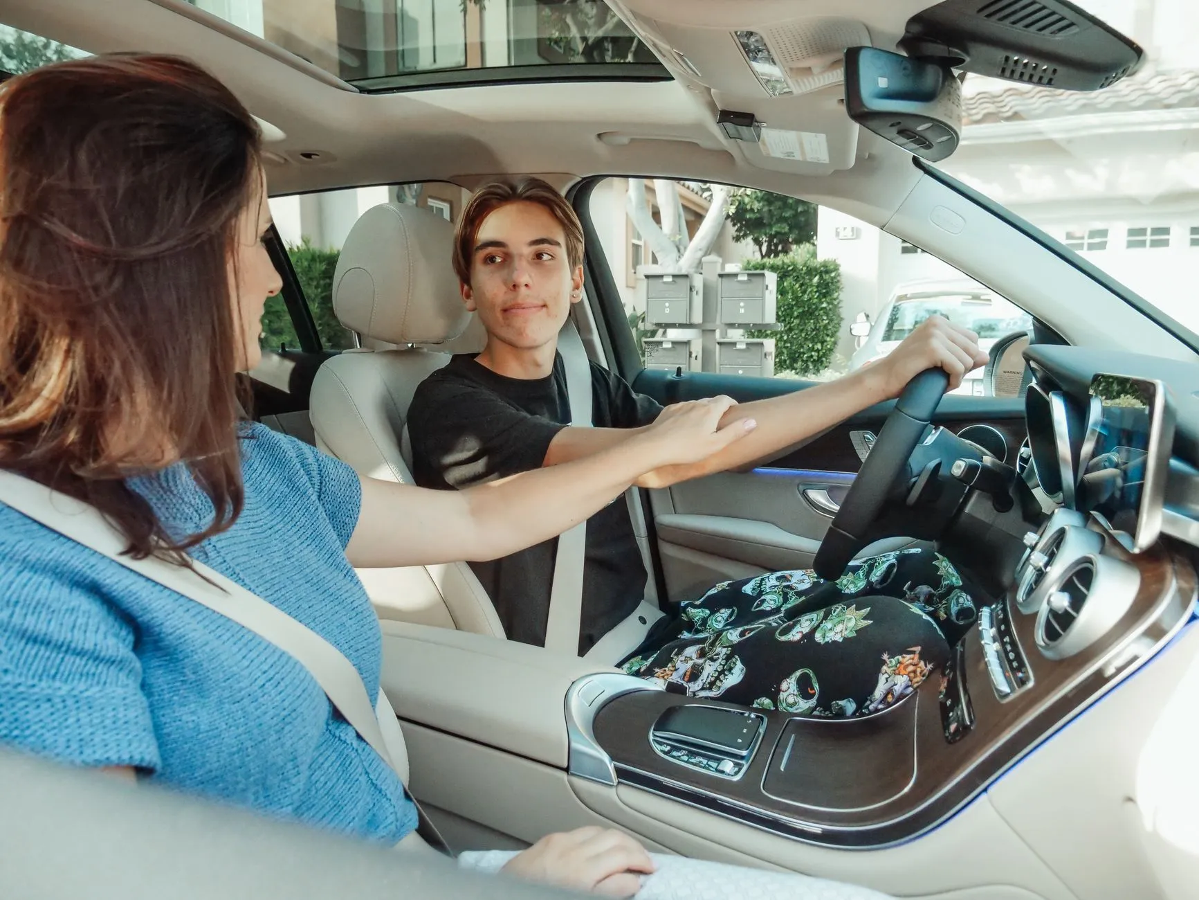 a student driver practicing on a residential street