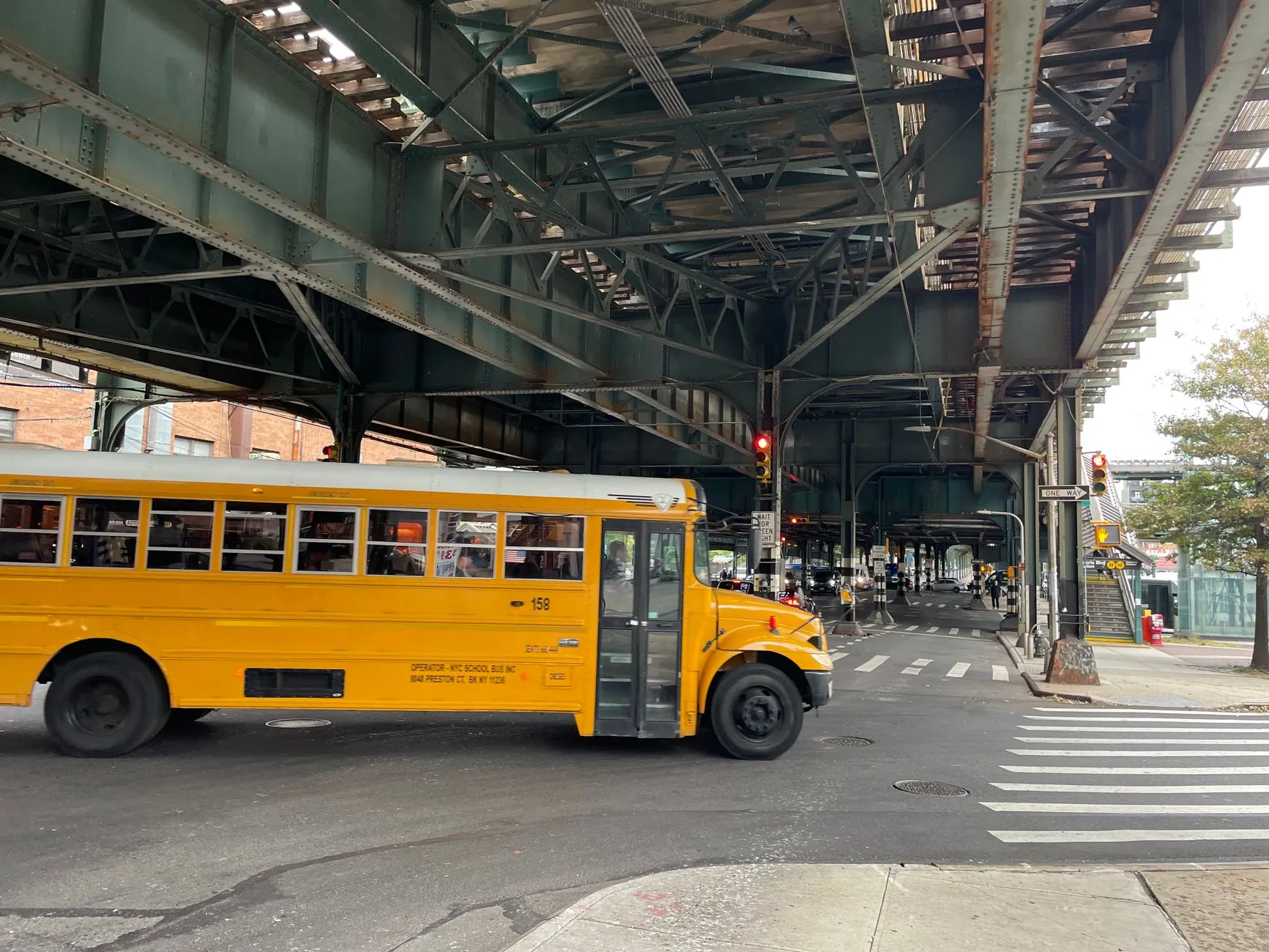 an elevated train over a Queens street