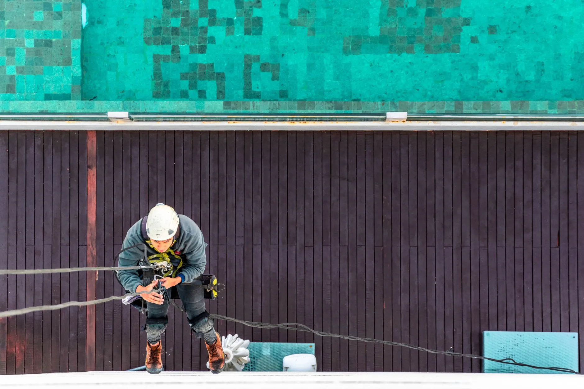 rope access technicians inspecting a building facade