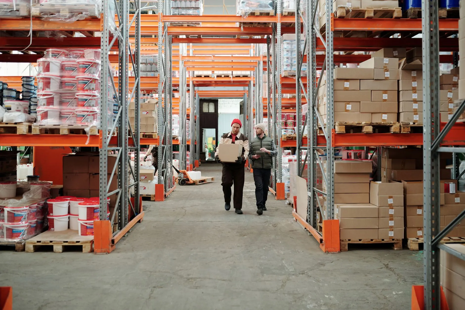 a warehouse with tall shelving and boxes