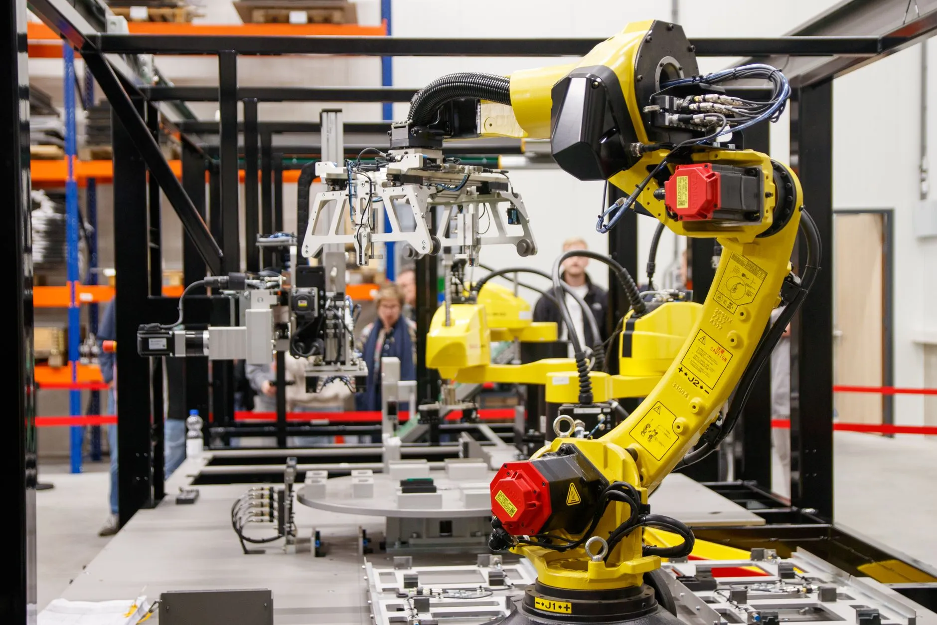 a robotic arm on an assembly line