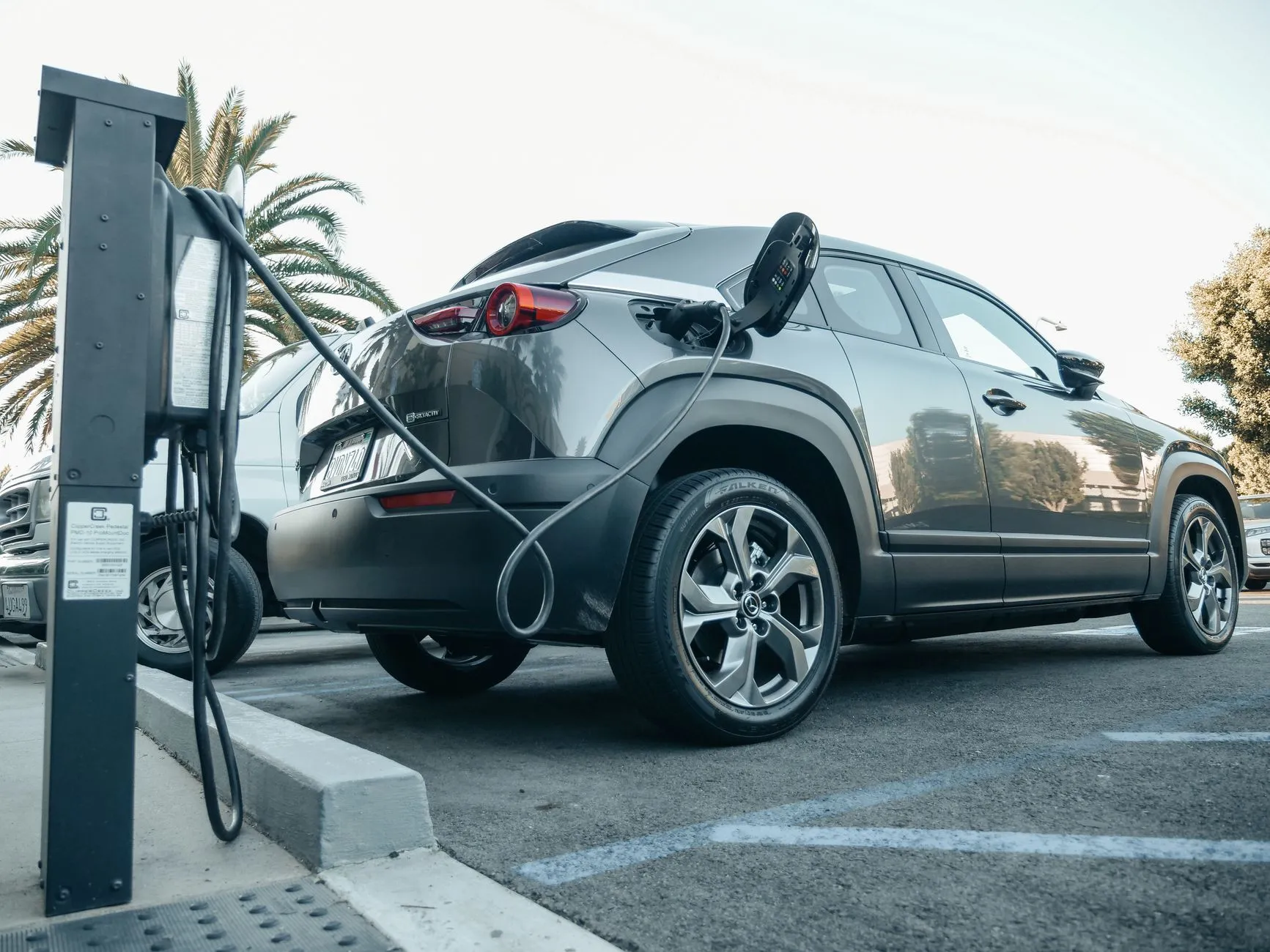 an electric car charging at a station