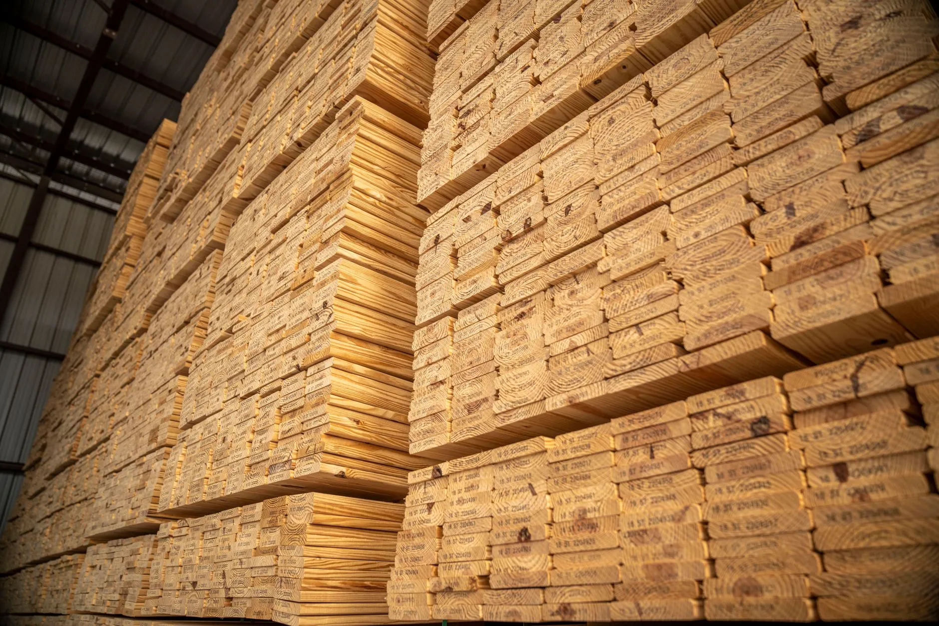stacked timber beams in golden light
