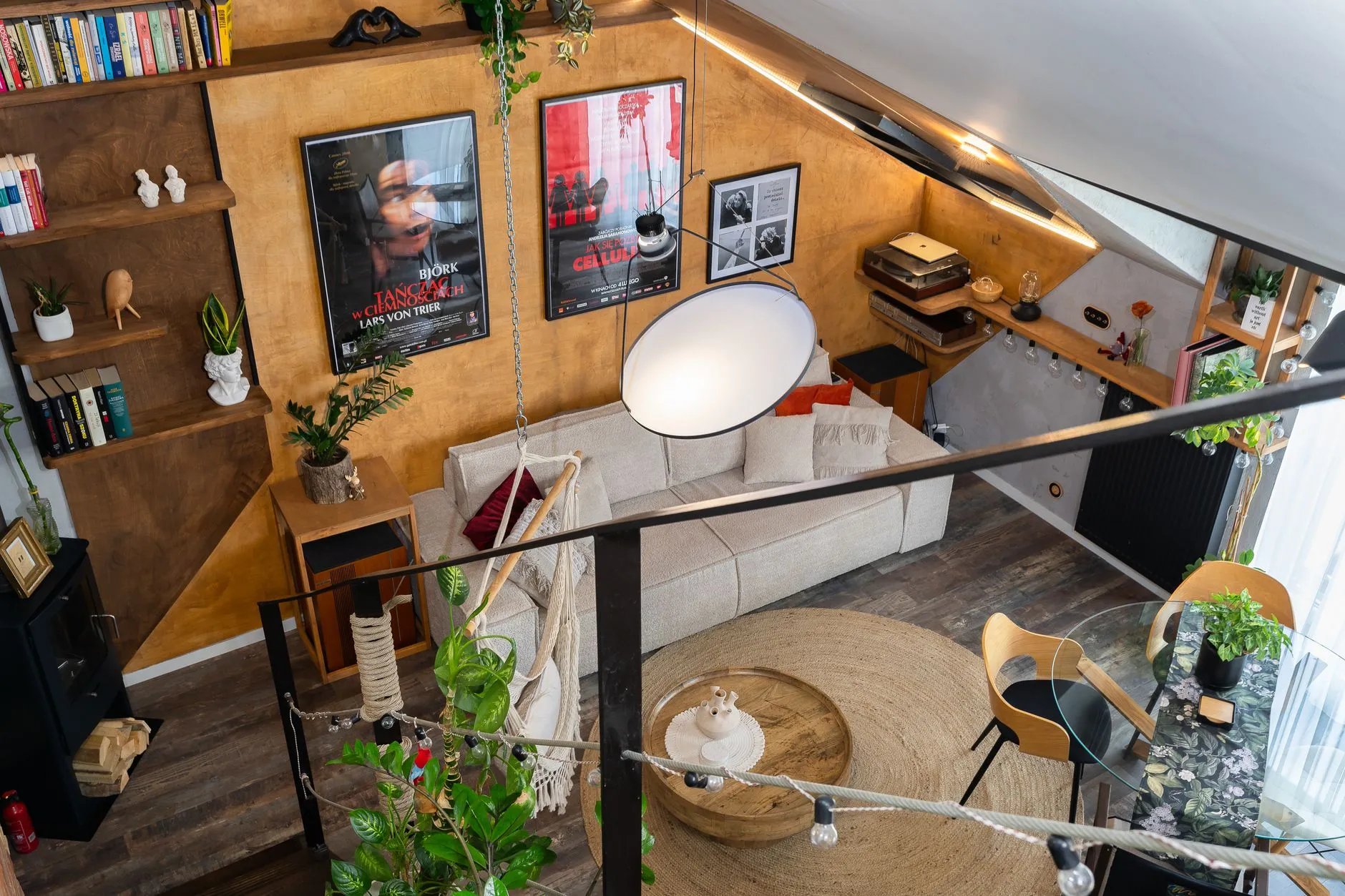 a small loft with multi-functional furniture and layered light