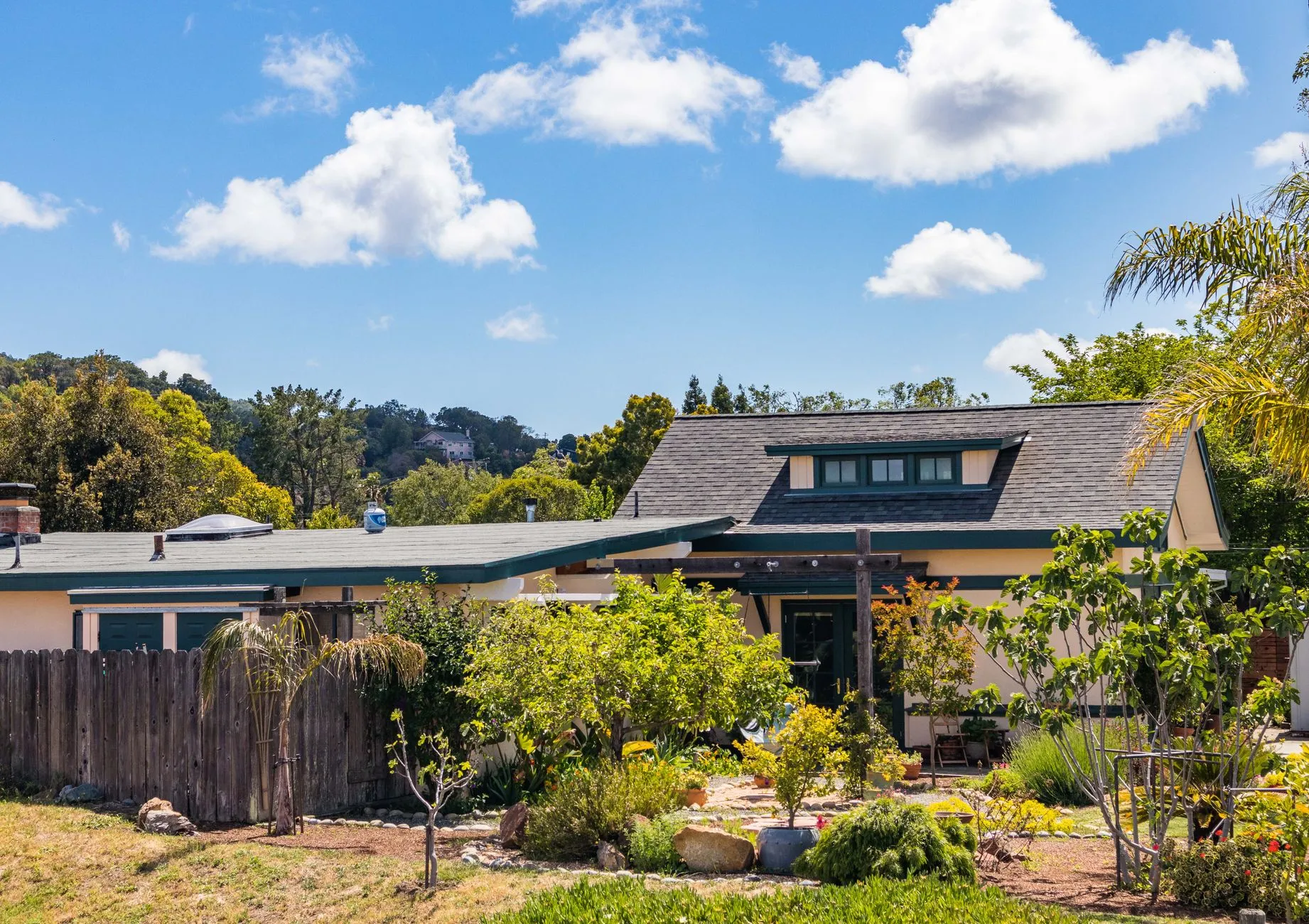 a California bungalow behind a garden of drought-tolerant plants