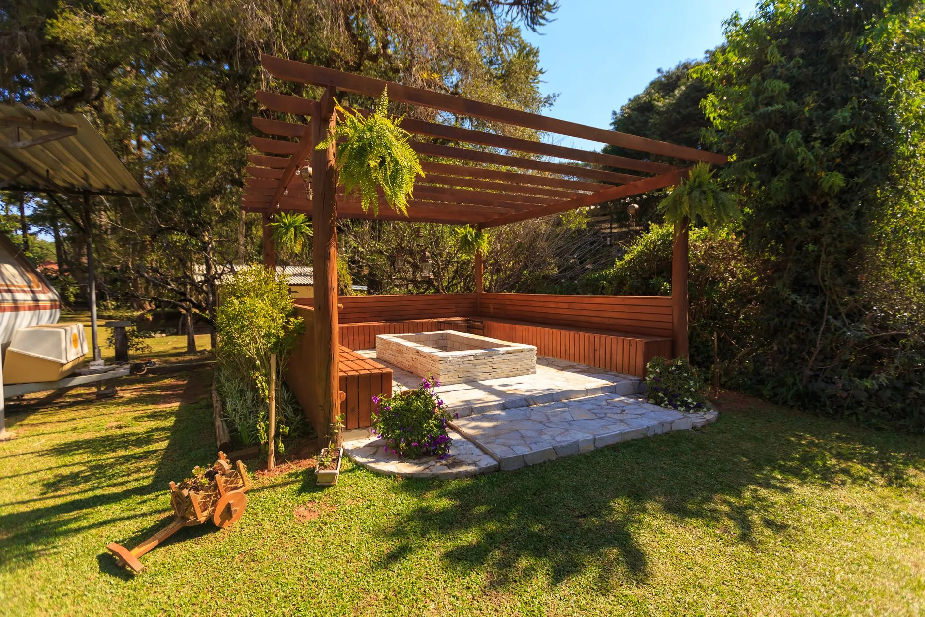 stained wood pergola over a patio