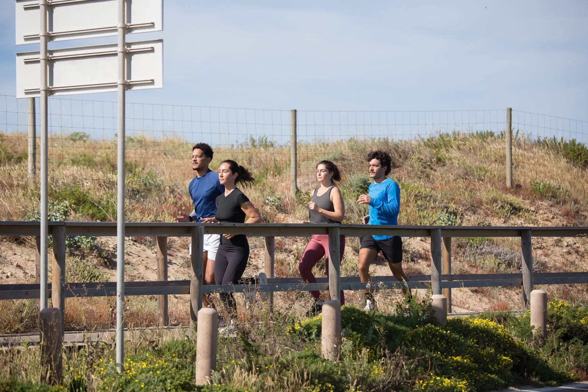 a group running together outdoors at sunrise
