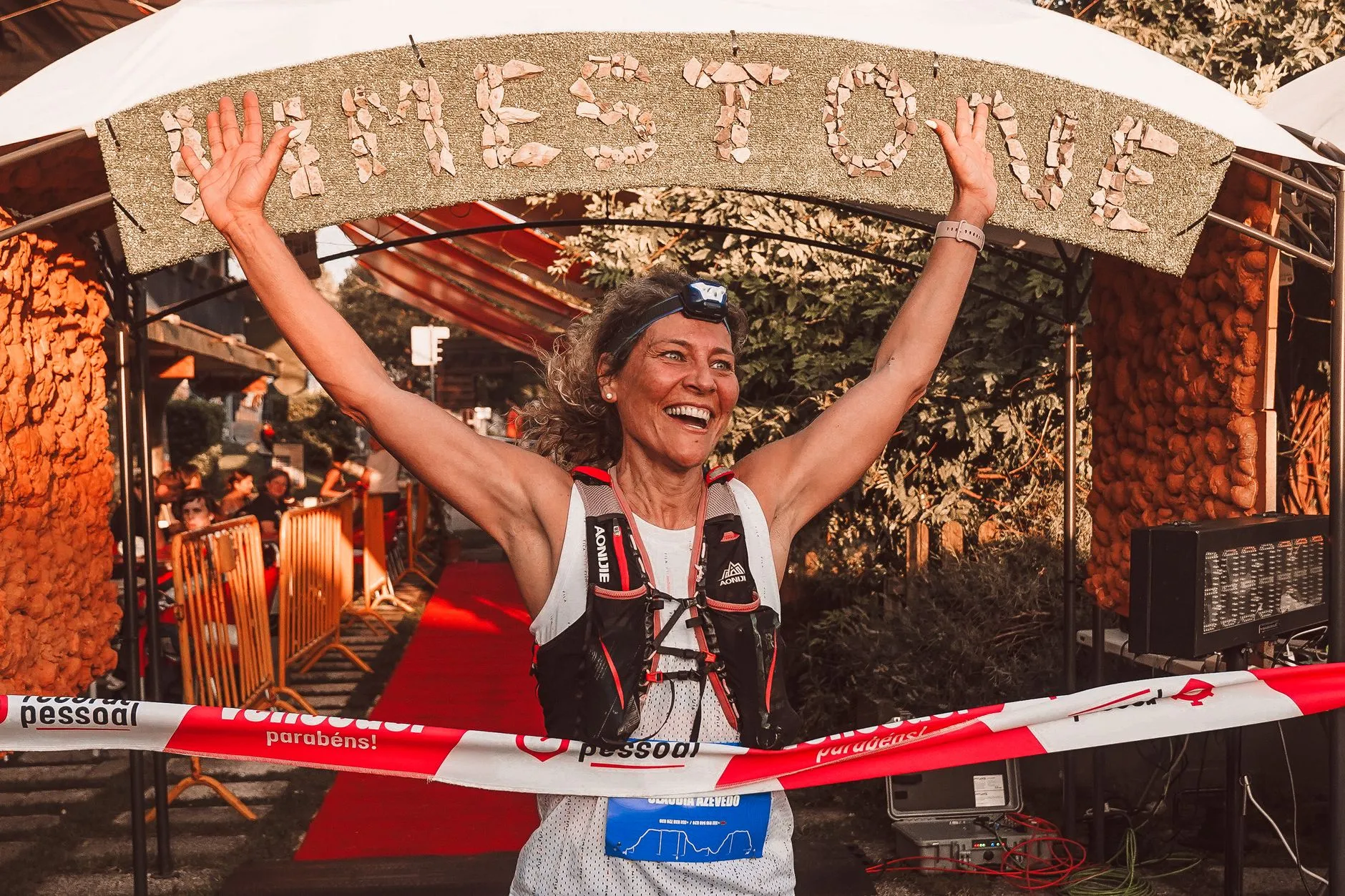 a happy person celebrating their fitness results