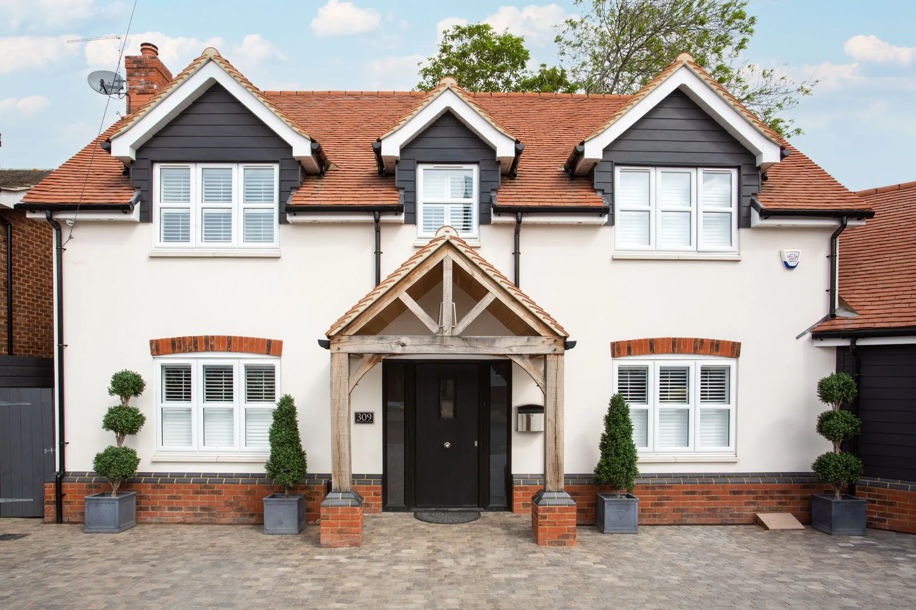 Modern two-story house with black window frames