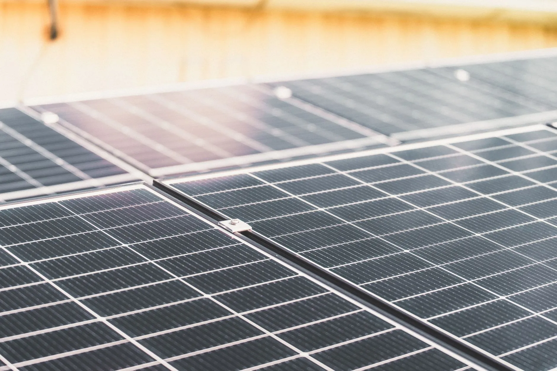 a close-up of solar panels on a roof in bright sunlight