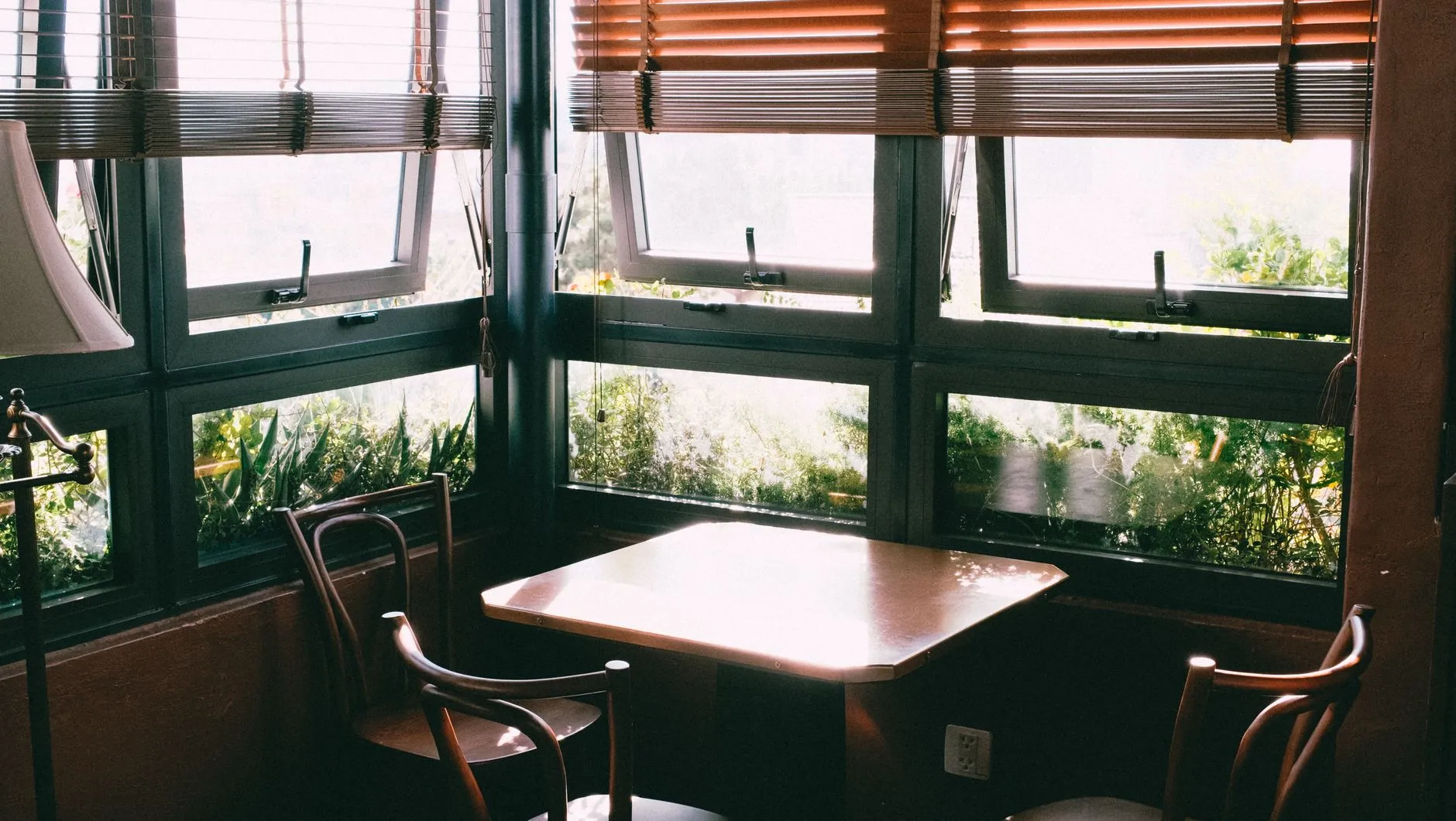 a plain testing room with a table, two chairs and a window