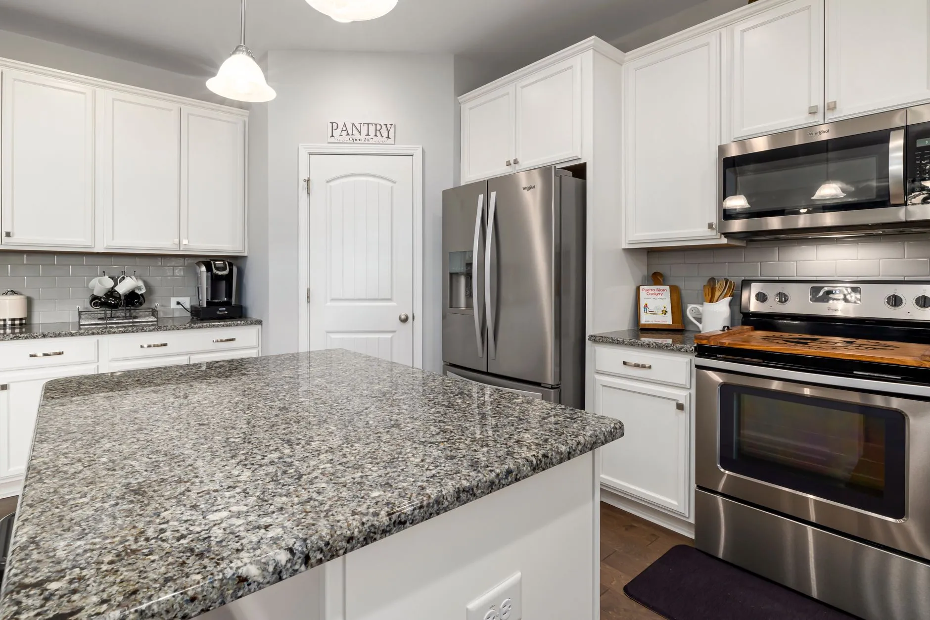 a freshly painted modern kitchen with white cabinets