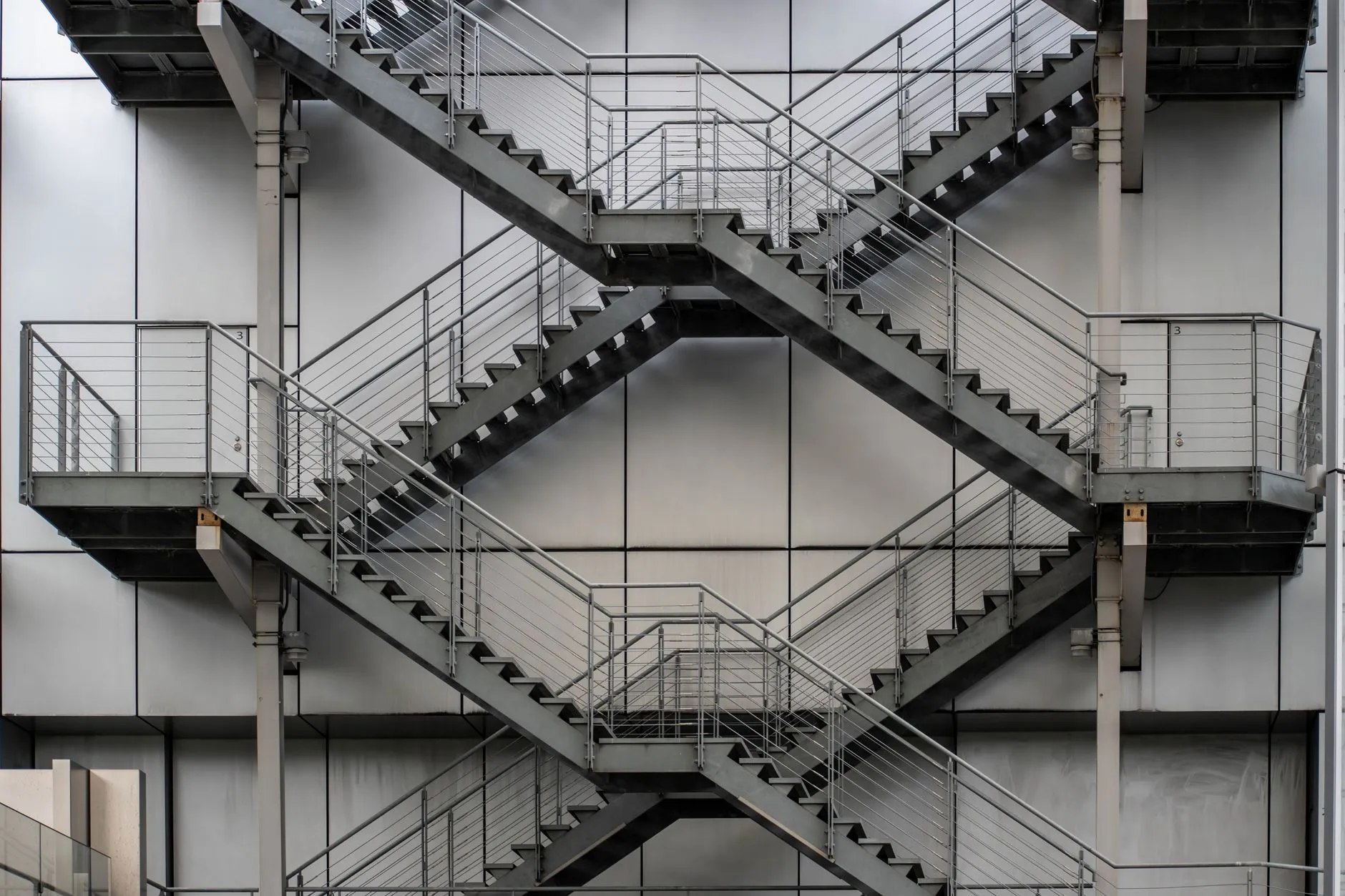 an industrial steel staircase with guardrails