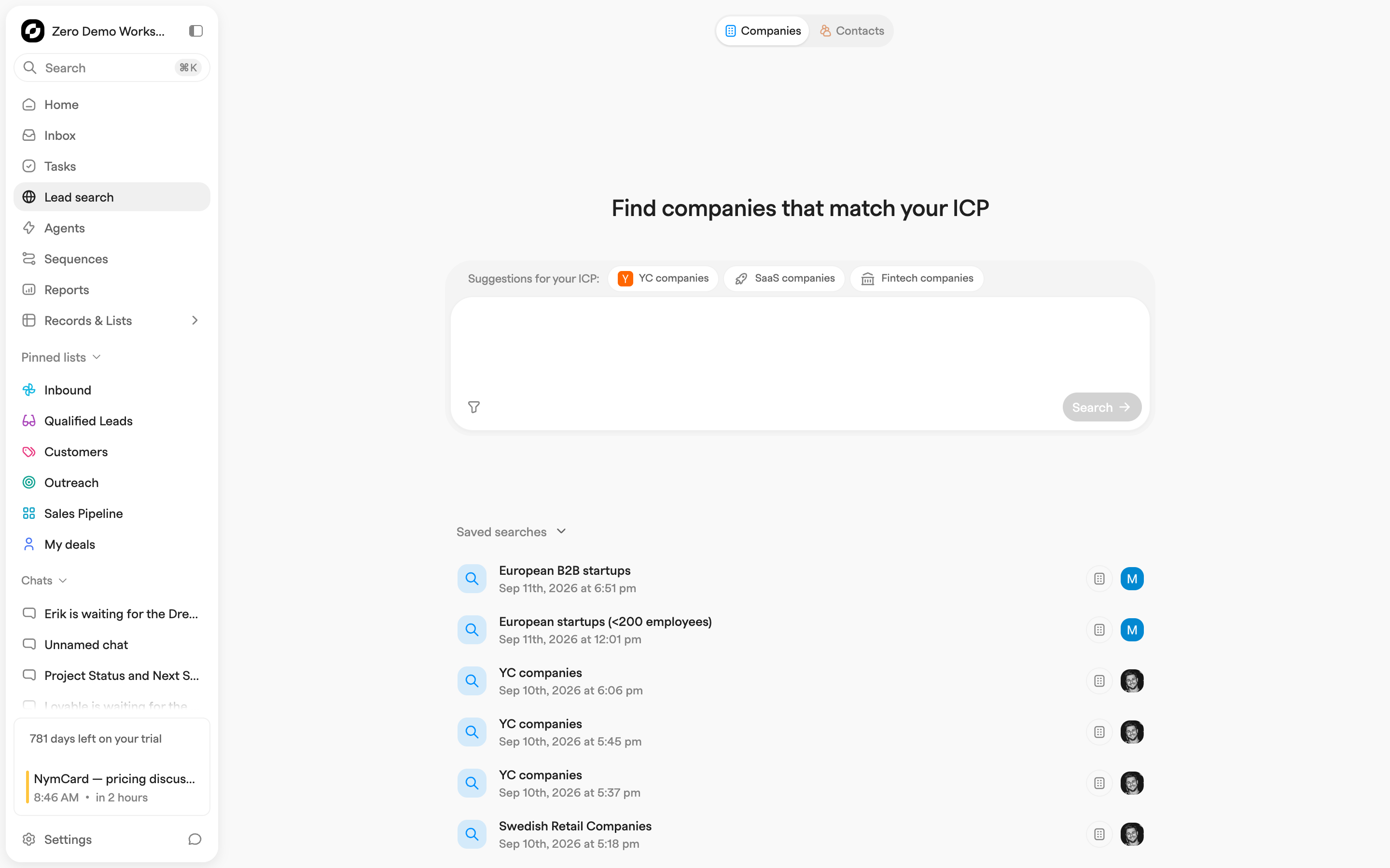 Lead search start page with Companies and Contacts tabs, ICP suggestion chips, a search box and a list of saved searches