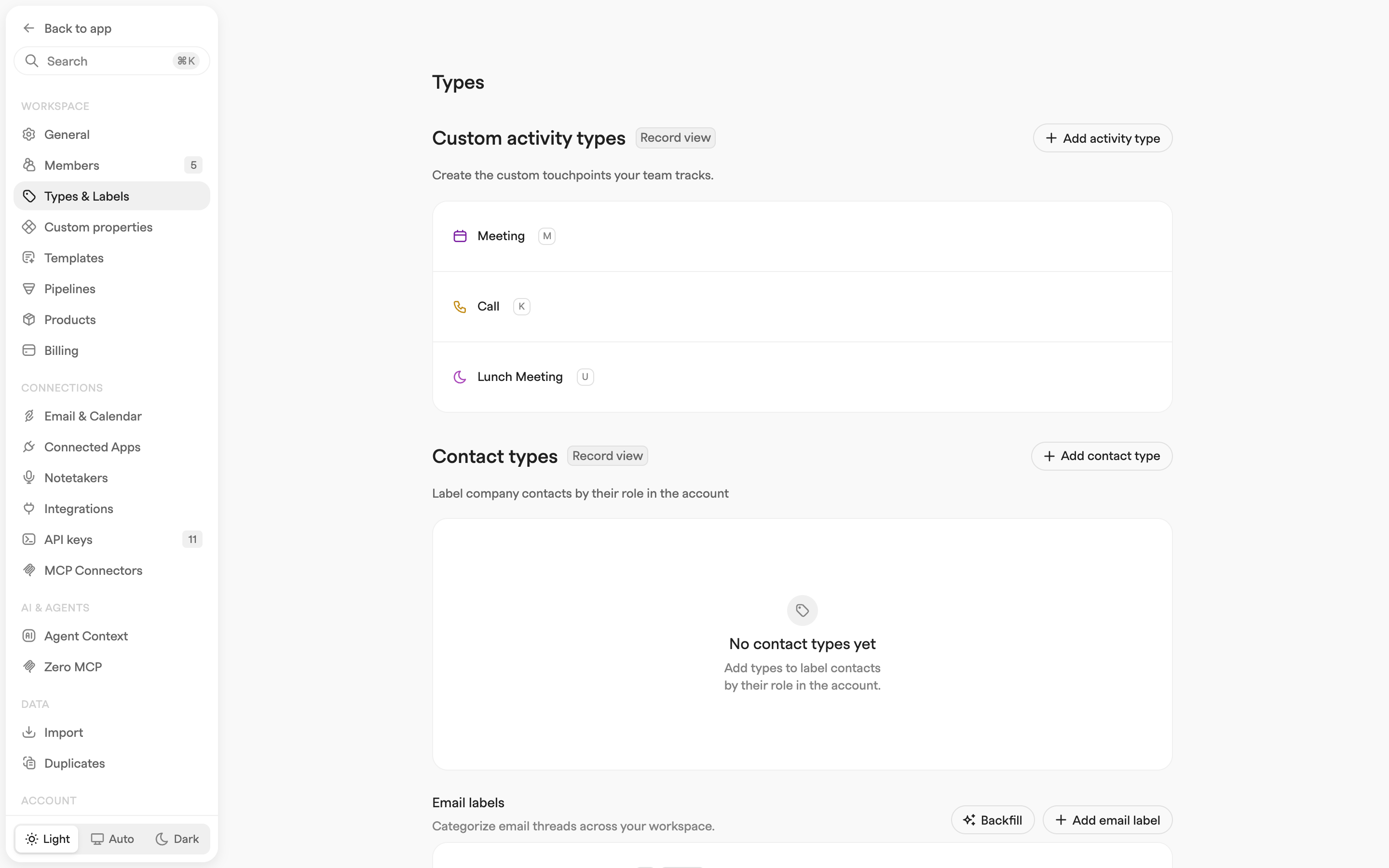 Types settings page showing custom activity types, an empty contact types panel and the start of the email labels section