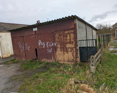 Double garage avec terrain