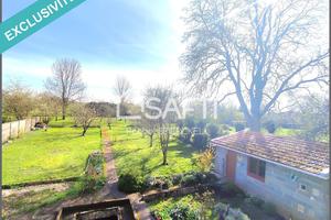 Maison individuelle en pierres de taille avec garage, dépendance, combles aménageables et jardin