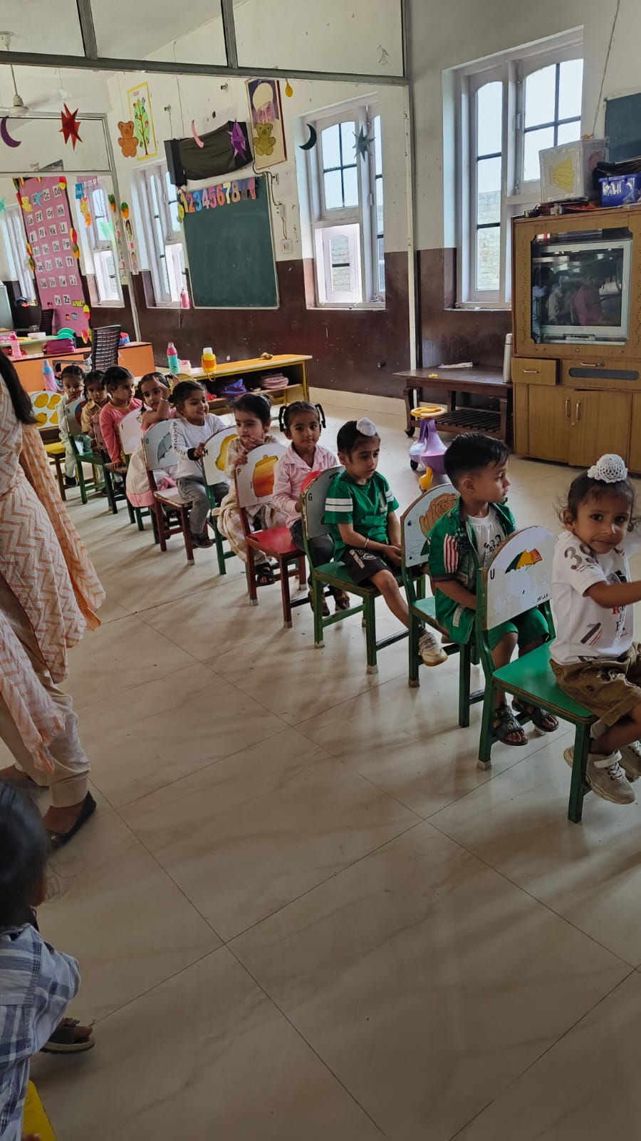 Pass the ball activity done by nursery Champs